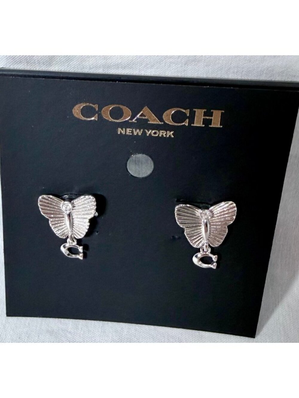Coach butterfly earrings